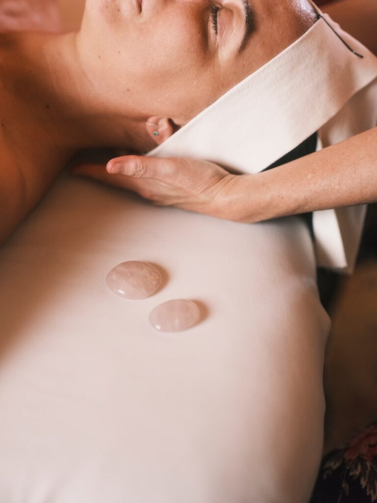 a person holding a white plate with coins on it