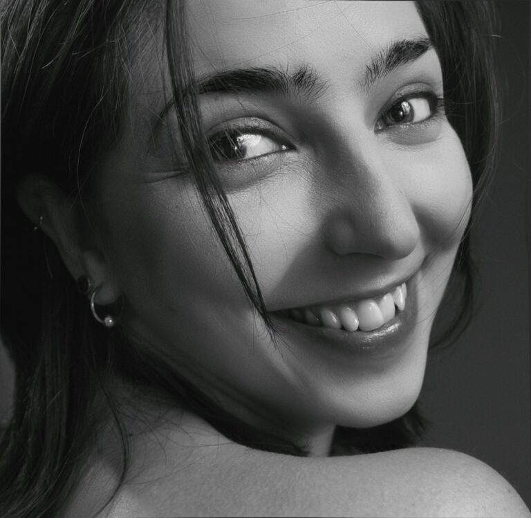 grayscale photo of womans face